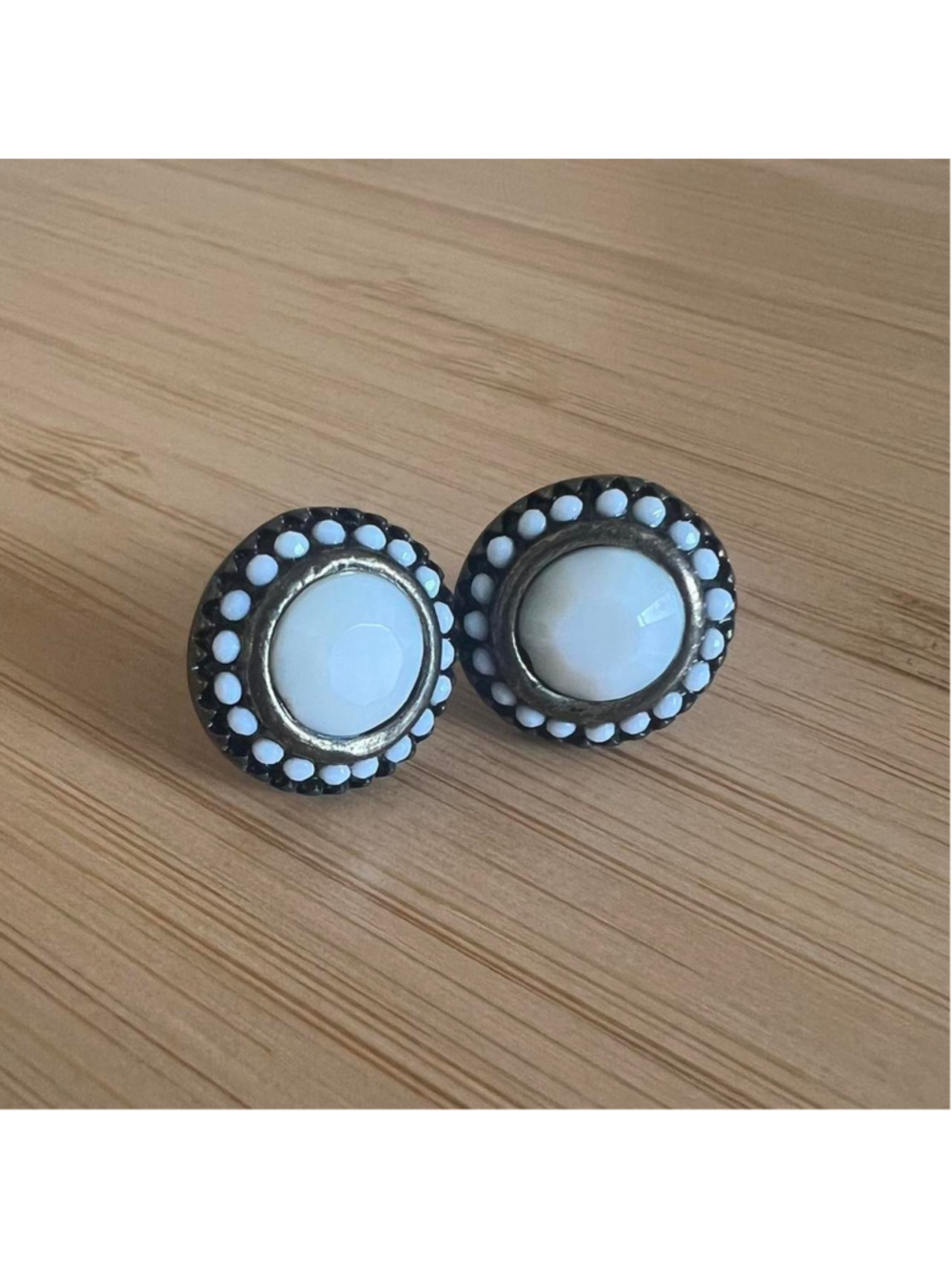 Vintage-looking bronze and white stud earrings